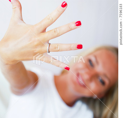 Happy young woman showing her proposal ring from her boyfriend. Happy young woman showing her proposal ring from her boyfriend. 7596183