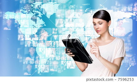 Portrait of young woman holding her tablet computer and communic Portrait of young woman holding her tablet computer and communic 7596253