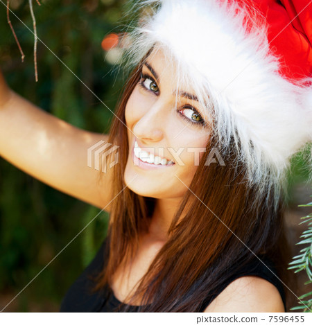 Portrait of a sexy young female smiling in a park and looking at Portrait of a sexy young female smiling in a park and looking at 7596455