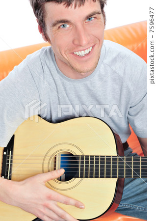 Young man with guitar 7596477