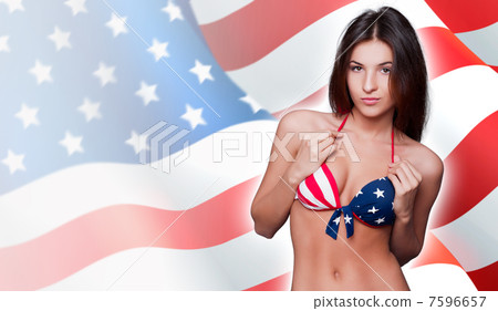 20-25 years old beautiful woman in swimsuit with american flag a 20-25 years old beautiful woman in swimsuit with american flag a 7596657
