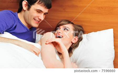 Young man and woman in bed. Couple. 7596660