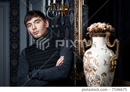 Elegant man posing in a stylish interior Elegant man posing in a stylish interior 7596675