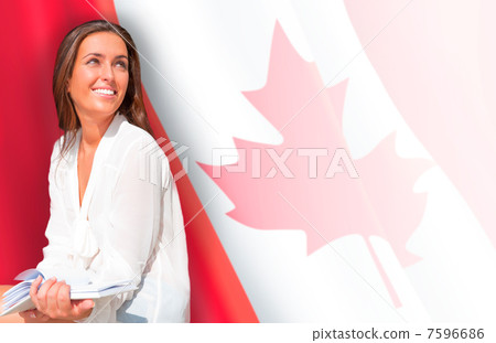 Portrait of pretty young woman holding book in her arms. Canadia 7596686