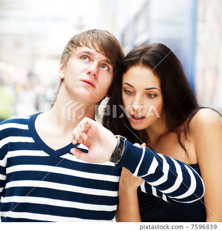 Portrait of young couple standing together at airport hall and l Portrait of young couple standing together at airport hall and l 7596839