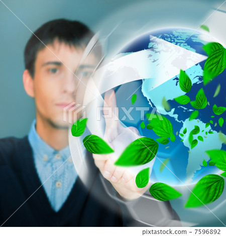 Portrait of young man sitting indoors at his office and working. 7596892