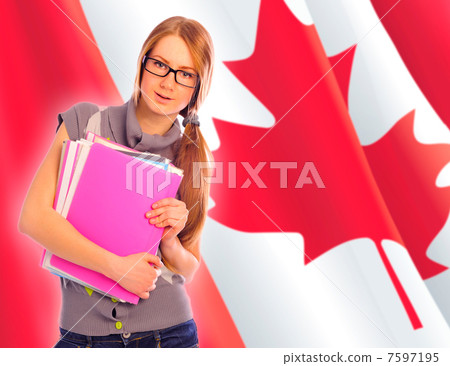 Portrait of pretty young woman holding book in her arms. Canadia Portrait of pretty young woman holding book in her arms. Canadia 7597195