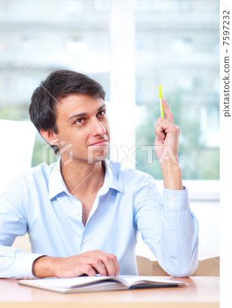 Businessman sitting indoors and writing plan in his diary Businessman sitting indoors and writing plan in his diary 7597232