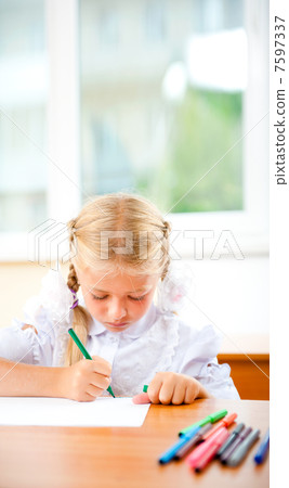 Little girl looking for a drawing concept wile painting picture 7597337