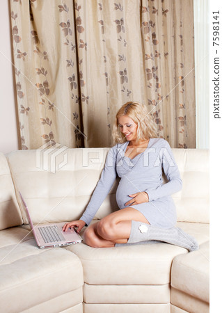Pregnant woman at home 7598141