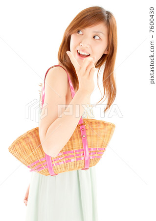 A cool fancy woman pointing her fingers looking backwards with a sleeveless appearance 7600430
