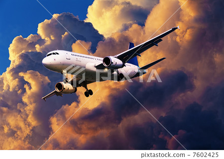 Jet aircraft in a sunset sky Jet aircraft in a sunset sky 7602425
