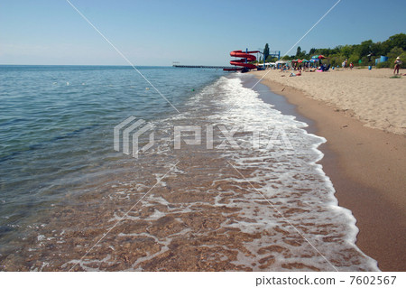 Sandy coast of lake. 7602567