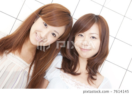 Two women with a smile 7614145