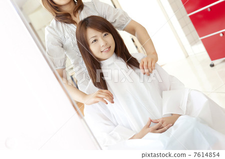 A woman whose wife is wearing a cut cross 7614854
