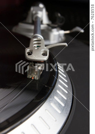 Turntable playing vinyl record with music Turntable playing vinyl record with music 7628558