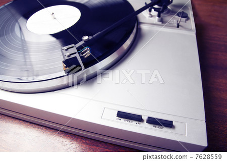 Turntable playing vinyl record with music Turntable playing vinyl record with music 7628559