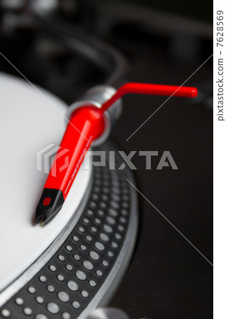 Turntable playing vinyl record 7628569