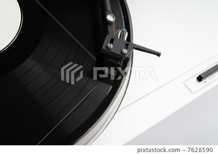 Turntable playing vinyl record with music Turntable playing vinyl record with music 7628590