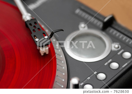 Closeup of turntable needle on record 7628630