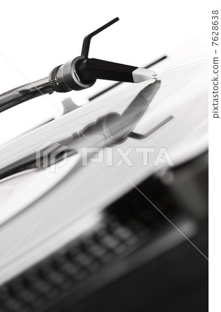 Turntable playing the record 7628638