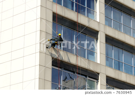 Steeplejack works, cleaning facade 7630945