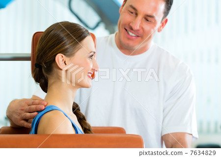 Patient at the physiotherapy doing physical therapy 7634829
