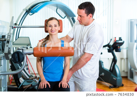 Patient at the physiotherapy doing physical therapy 7634830