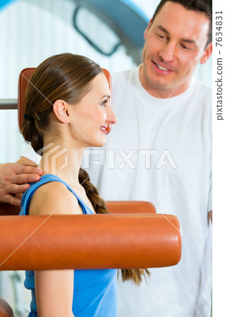 Patient at the physiotherapy doing physical therapy 7634831