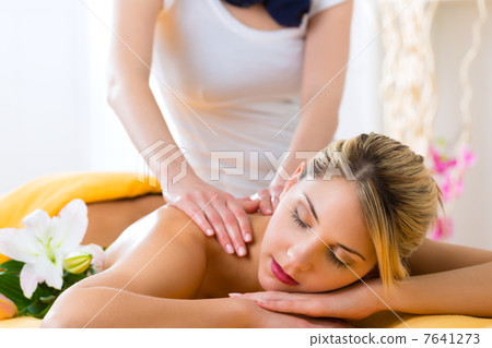 Wellness - woman getting body massage in Spa 7641273