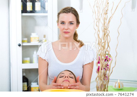 Wellness - woman getting head massage in Spa Wellness - woman getting head massage in Spa 7641274