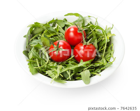 ruccola and tomatoes in white bowl 7642635