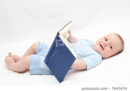 baby reading a book on back baby reading a book on back 7645654