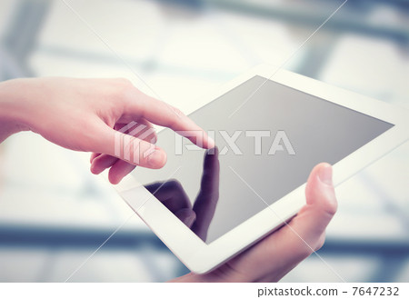 white tablet with a  blank screen in the hands 7647232