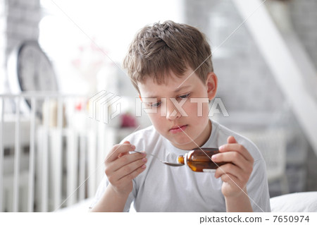 boy drinking cough syrup boy drinking cough syrup 7650974
