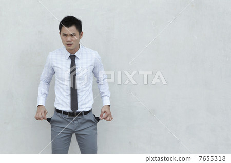 Asian Businessman with empty pockets 7655318