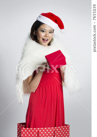 Happy woman wearing a Christmas hat Happy woman wearing a Christmas hat 7655839