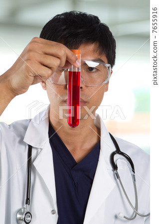 Portrait of scientist analyzing a solution. Portrait of scientist analyzing a solution. 7655916