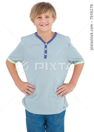Young child with a blue shirt smiling 7656276