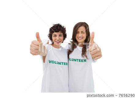 Two happy volunteers giving thumbs up 7656290