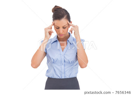 Businesswoman thinking with fingers on her temples 7656346