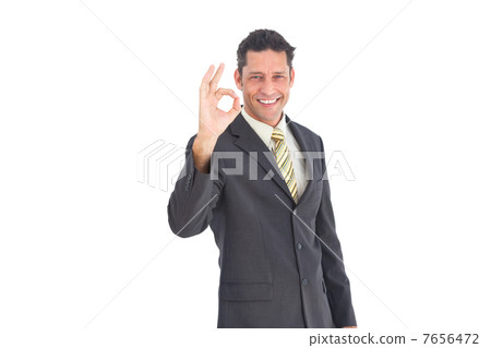 Smiling businessman saying ok Smiling businessman saying ok 7656472