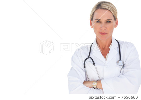 Doctor smiling with her arms crossed Doctor smiling with her arms crossed 7656660