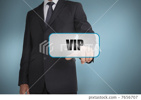 Businessman touching tag with vip written on it 7656707