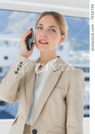 Serious businesswoman having a call Serious businesswoman having a call 7656789