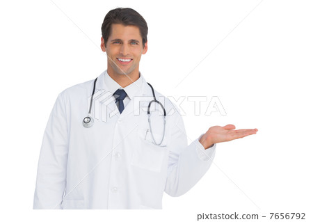 Happy doctor showing something and smiling Happy doctor showing something and smiling 7656792