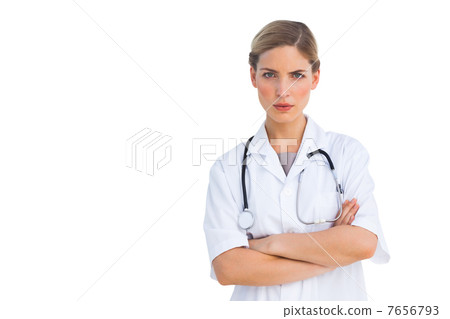 Serious nurse looking at the camera Serious nurse looking at the camera 7656793
