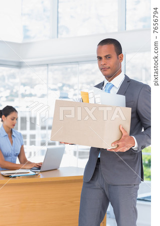 Upset businessman leaving the company 7656794