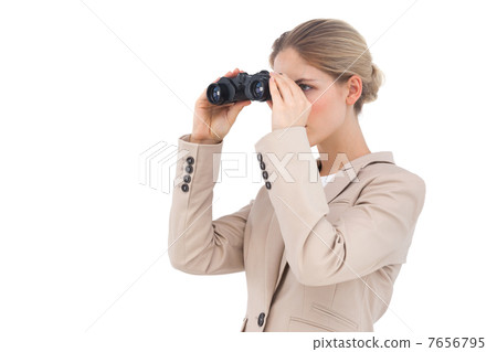 Businesswoman looking away with binoculars Businesswoman looking away with binoculars 7656795