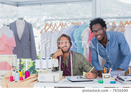 Fashion designers working together in a creative office 7656890